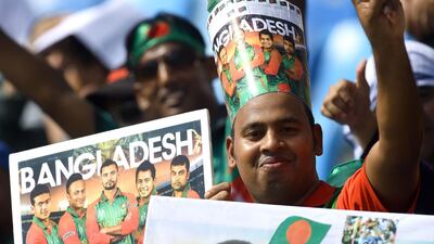 Bangladeshi cricket fans cheer in support of their national team during the one day international (ODI) Asia Cup cricket match between Bangladesh and Sri Lanka at the Dubai International Cricket Stadium in Dubai on September 15, 2018. / AFP / ISHARA S. KODIKARA