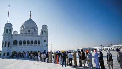 Sikh Pilgrims stand in a queue to visit the Shrine of Baba Guru Nanak Dev at Gurdwara Darbar Sahib in Kartarpur, near the Indian border. AFP