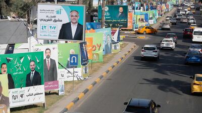Campaign posters in central Baghdad. About 20 million voters are eligible to choose from 7,744 candidates in the election. AFP