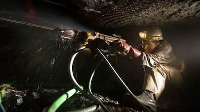 Mineworkers drill at the rock face at the Impala platinum mine in Rustenburg, South Africa. The country accounts for 30 percent of the CIVETS fund.