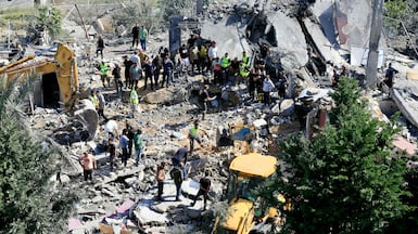 The aftermath of an Israeli air strike in the village of Saksakieh, southern Lebanon, where the search for survivors is under way. AFP