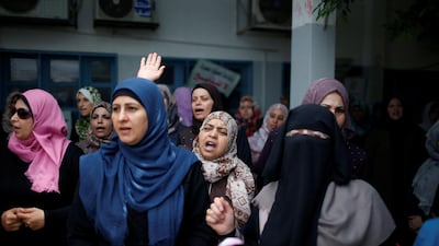 Palestinian UNRWA employees take part in a protest after losing their jobs in Gaza City. Mohammed Salem / Reuters