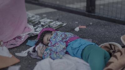 Shehd, 7, sleeping on the ground in Hungary: Shehd loves to draw, but more recently all of her drawings have the same theme: weapons. “She saw them all the time, they are everywhere”, explains her mother as the little girl sleeps on the ground alongside Hungary’s closed border. Now she does not draw at all. The family brought neither paper nor crayons with them on their flight. he family has had difficulty finding food during their wandering. Some days they make do with apples picked from trees along the road. If the family had known how hard the journey would be they would have chosen to stay in Syria despite the risk to their lives, they say.