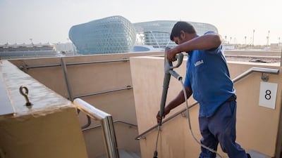Stairs leading up to the stands are hosed down ahead of the 60,000 visitors expected this weekend. Courtesy Yas Marina Circuit