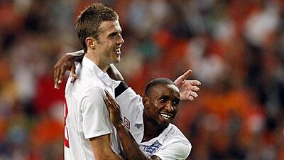 Jermain Defoe, right, celebrates with Michael Carrick after his brace earned England a 2-2 draw in