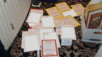 A redacted FBI photograph of classified documents recovered from a container in former president Donald Trump's estate at Mar-a-Lago in Palm Beach, Florida. Reuters