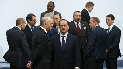 French president Francois Hollande (C) and foreign minister Laurent Fabius (C-L) await the arrival of world leaders at the COP21 World Climate Change Conference 2015 in Le Bourget, north of Paris on November 30. EPA