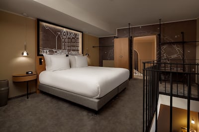 Bedroom in the King Art duplex suite. Photo: Hilton