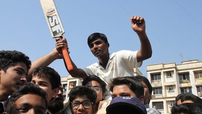Mumbai schoolboy Pranav Dhanawade, 15, is carried as he celebrates smashing a 117-year-old record for the highest number of runs scored in one innings in Mumbai on January 5, 2016. A Mumbai schoolboy made history on January 5 when he became the first batsman in any class of cricket to score 1,000 runs in a single innings, with Indian legend Sachin Tendulkar leading the plaudits. Dhanawade smashed his way to 1,009 not out off 323 balls. AFP