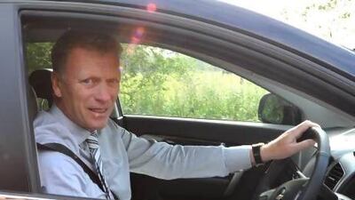 New Manchester United manager David Moyes arrives at the team training ground Monday for his first official day in charge. Martin Rickett / AP Photo