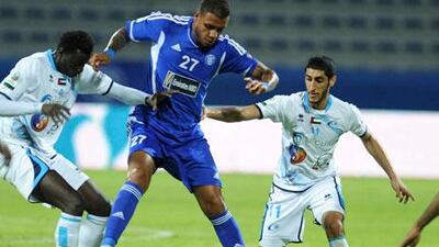 Linardo Lima of Al Nasr finds himself surrounded by Baniyas players. Al Nasr got two goals from Mark Bresciano to win Saturday night.