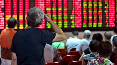 Doubling up on the most volatile equities has become a go-to strategy for many of China's 96 million individual investors as the stock market shows early signs of recovery. Johannes Eisele / AFP