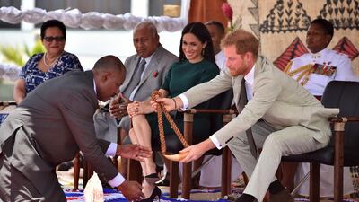 Prince Harry receives a whale tooth necklace. Reuters