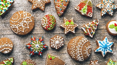 Christmas gingerbread cookies on wooden table with sugar