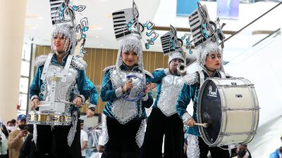 The band in all their finery before the start of the Dubai World Cup. Pawan Singh / The National
