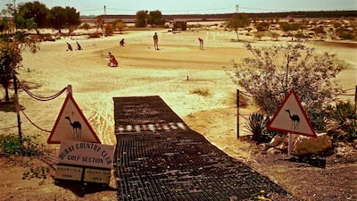 The 18th hole of the sand golf course at the Dubai Country Club in 1999. Phil Sheldon / Popperfoto / Getty Images
