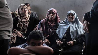 Palestinians wait for travel permits to cross into Egypt through the Rafah border crossing on August 16, 2017. Said Khatib / AFP Photo
