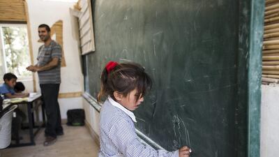 A pupil takes part in a classroom activity.