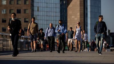 Morning commuters cross London Bridge in London. British officials have raised concern over the coronavirus Delta variant and rising infection rates. Getty Images