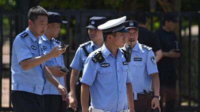 Chinese police stand outside the US embassy in Beijing. AFP