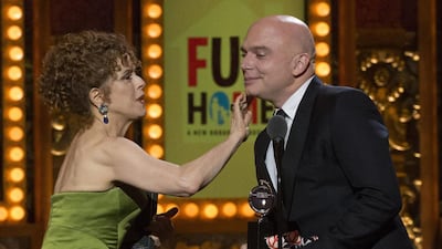 Actress Bernadette Peters presents Michael Cerveris with the award for Best Performance by an Actor in a Leading Role in a Musical for Fun Home during the Tony Awards. Lucas Jackson / Reuters