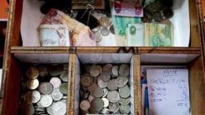 Analysts say the Gulf states' commitment to the dollar peg is holding back their economies.