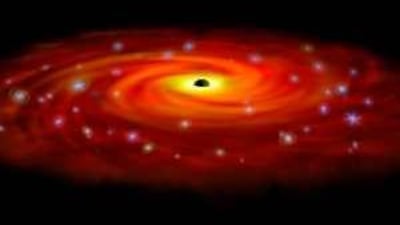 An artist's depiction of the Sagittarius A* supermassive black hole in the Milky Way. Though string theory was devised to explain such cosmic phenomena as black holes, it has proved to be applicable on Earth too.