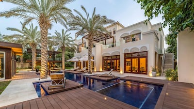 Wooden decking surrounds the pool.