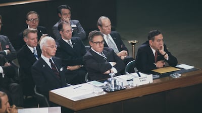 December 21, 1973. The US delegation attending the Geneva Conference in Switzerland to discuss the Israel-Syria situation. Front, left to right: Ellsworth Bunker, diplomat; Henry Kissinger; and Joseph Sisco, US head of Middle Eastern affairs