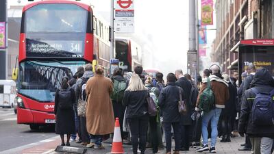 Passengers try to board a bus at Waterloo station in London, with the UK capital braced for a third day of travel misery caused by Tube strikes. PA