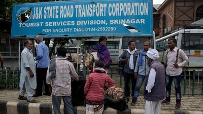 Indian pilgrims wait in Srinagar for buses to leave Kashmir on August 3, 2019. AP Photo