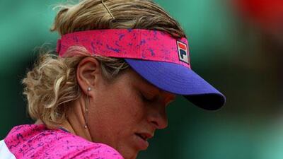 Kim Clijsters threw away two match points against Aranxta Rus and exited the French Open at the second round after the Dutchwoman won their match 3-6, 7-5, 6-1.