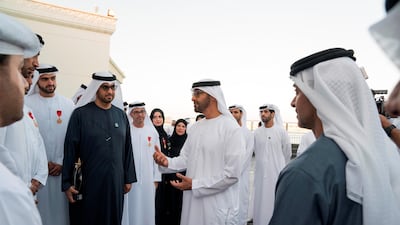 Sheikh Mohammed bin Zayed, Crown Prince of Abu Dhabi Deputy Supreme Commander of the UAE Armed Forces, speaks with the winners and organisers of the Abu Dhabi Award for Excellence in Government Performance, during a Sea Palace barza. Seen with Dr Sultan Al Jaber, Minister of State, Chairman of Masdar and chief executive of Adnoc Group (3rd R) and Sheikh Hazza bin Zayed, Vice Chairman of the Abu Dhabi Executive Council (R). Mohammed Al Hammadi / Crown Prince Court - Abu Dhabi