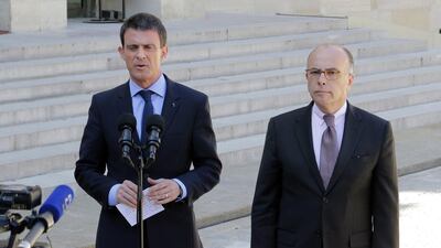 French prime minister Manuel Valls, left, and interior minister Bernard Cazeneuve, address the media after a cabinet meeting at the Elysee Palace in Paris on April 22. AP Photo