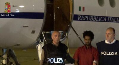 This June 7, 2016 file photo taken from a video and released by the Italian Police shows a man identified by prosecutors as Medhane Yehdego Mered a 35-year-old Eritrean, arrested two weeks earlier in Sudan, upon his arrival at Ciampino's airport, on the outskirts of Rome. AP, file