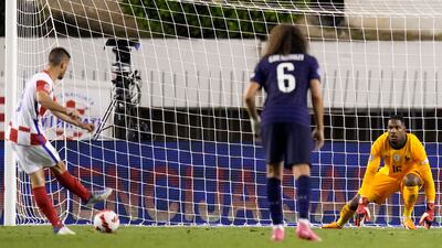 Croatia's Andrej Kramaric, left, scores his side's equaliser from the penalty spot. AP Photo