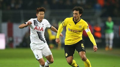 Mats Hummels of Borussia Dortmund is chased by Son Heung-min of Tottenham Hotspur during the UEFA Europa League Round of 16 first leg match between Borussia Dortmund and Tottenham Hotspur at Signal Iduna Park on March 10, 2016 in Dortmund, Germany. (Photo by Lars Baron/Bongarts/Getty Images)