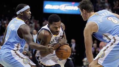 Memphis' Tony Allen is pressured by Denver's Ty Lawson and Danilo Gallinari