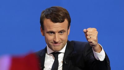 French centrist presidential candidate Emmanuel Macron clenches his fist as he addresses his supporters at his election day headquarters in Paris. Christophe Ena / AP Photo