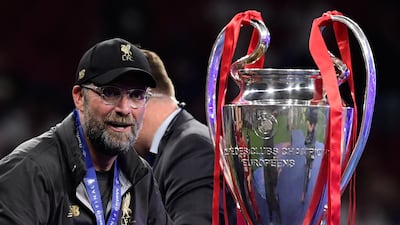 A delighted Klopp looks at the European Cup moments before he and his players received it. AFP