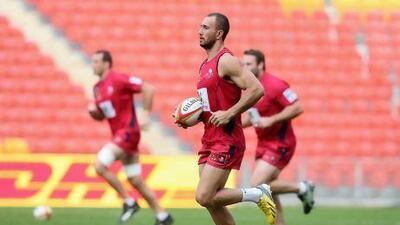 Quade Cooper, centre, will captain Queensland Reds when they face British & Irish Lions in what is likely Cooper's final chance to impress Australia coach Robbie Deans enough to get selected to the team.