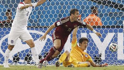 Alexander Kerzhakov of Russia reacts as he scores the equaliser against South Korea in a 1-1 draw on Tuesday night at the 2014 World Cup. Adrian Dennis / AFP / June 17, 2014