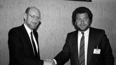 Sir Clive Sinclair shaking hands with Sir Alan Sugar, then head of Amstrad Consumer Electronics, after it was announced that Amstrad had bought all rights to sell Sinclair computers worldwide in 1986. PA