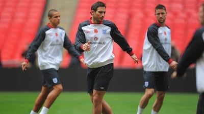 Frank Lampard, who will captain England today, displays his poppy during training at Wembley Stadium yesterday.