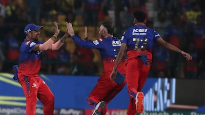 Royal Challengers Bengaluru's Glenn Maxwell, centre, celebrates the dismissal of Chennai Super Kings' captain Ruturaj Gaikwad for a first-ball duck. AP