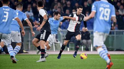 Juventus' Portuguese forward Cristiano Ronaldo outruns Lazio's Romanian defender Stefan Radu. AFP