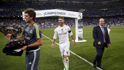 Real Madrid coach Rafa Benitez, with Sergio Ramos, celebrates winning the Santiago Bernabeu Trophy on Tuesday night against Galatasaray in Madrid. Juan Medina / Reuters / August 18, 2015