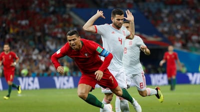 Spain's Nacho brings down Portugal's Cristiano Ronaldo to give away a penalty. Murad Sezer / Reuters