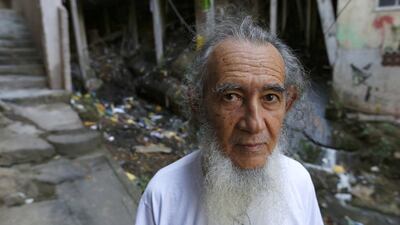 Jose Martins de Oliveira, a spokesman for Rocinha Sem Fronteiras, fighting for improved sanitation, next to one of the 23 raw sewage waterfalls in Rocinha Favela. Barbara Walton / EPA