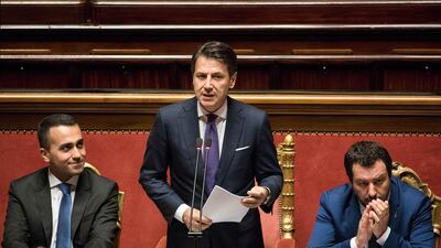 Giuseppe Conte, Italy's prime minister, delivers his maiden speech to the Senate flanked by his two deputy PMs, Luigi Di Maio, leader of the Five Star Movement, left, and League leader Matteo Salvini. Alessia Pierdomenico/Bloomberg